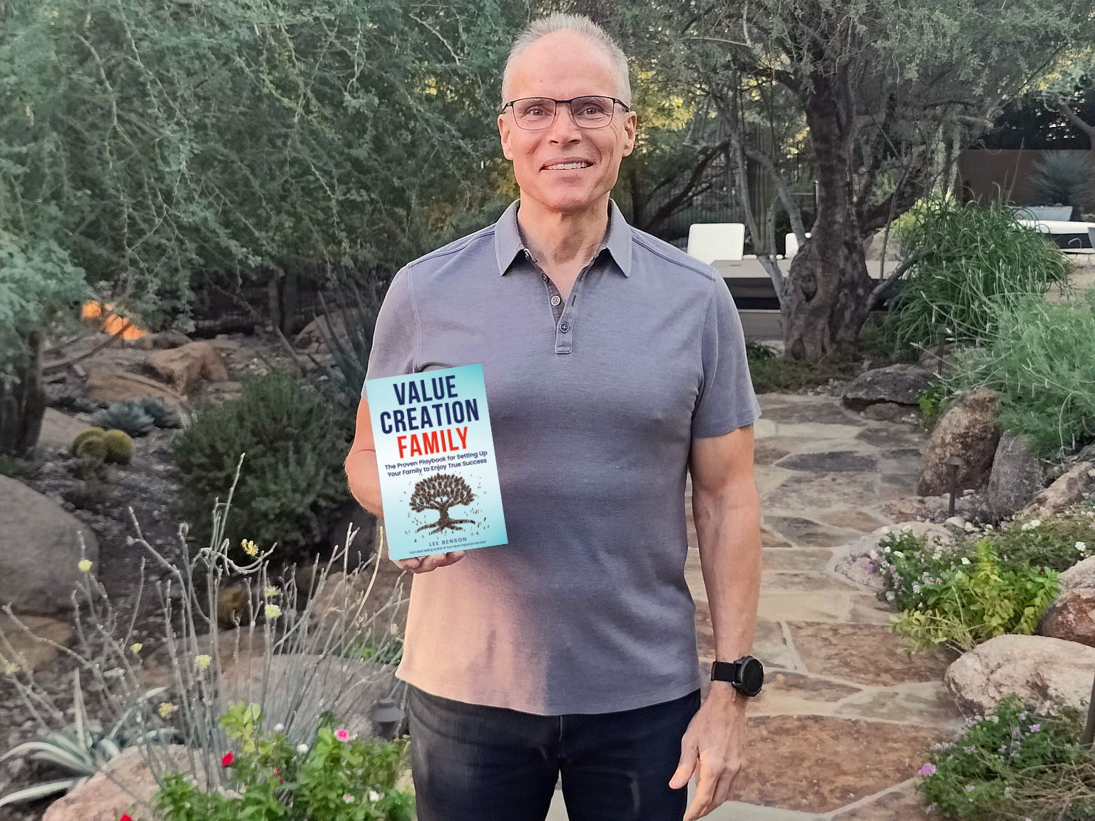 Lee Benson holding Value Creation Family